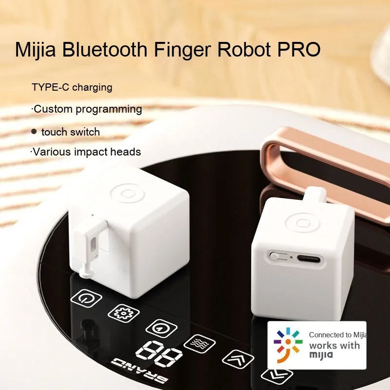Intelligent Bluetooth finger robot voice control remote controller white on table