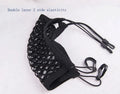 Black elastic nylon car pet fence isolation net installed on middle seat with hooks.