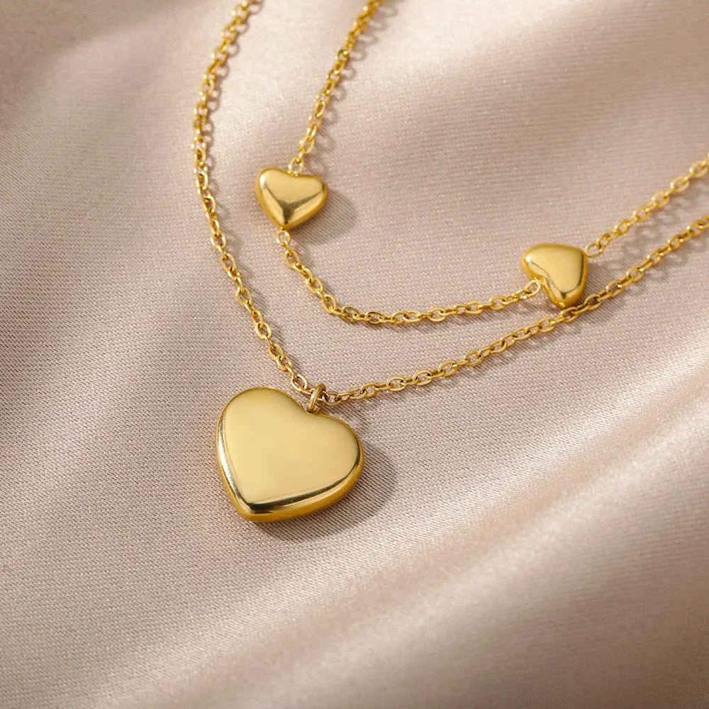 Multilayer heart pendant necklace with moon and star zircon accents on copper O-ring chain