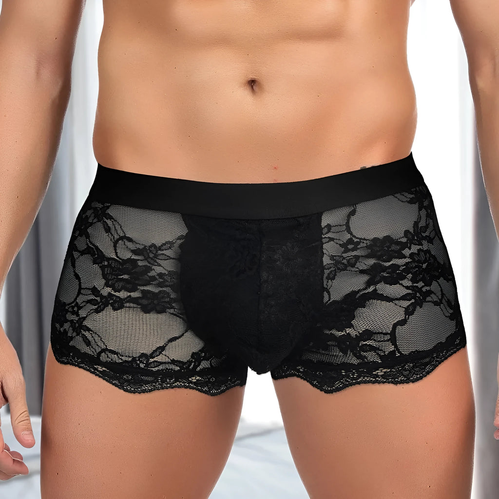 Men's black lace briefs with hollow out see-through design showing sheer nylon fabric