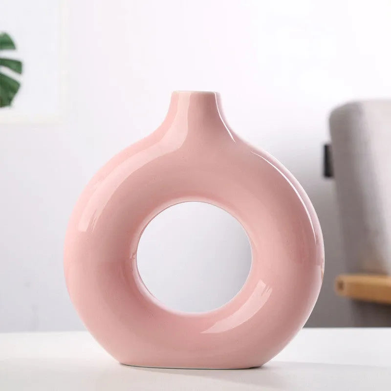 Unglazed porcelain biscuit vase with frosted particle surface in neutral colour