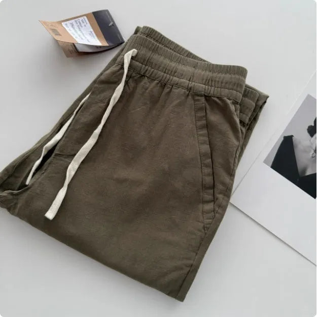 Men's loose straight casual pants in beige colour with drawstring waist detail for summer wear