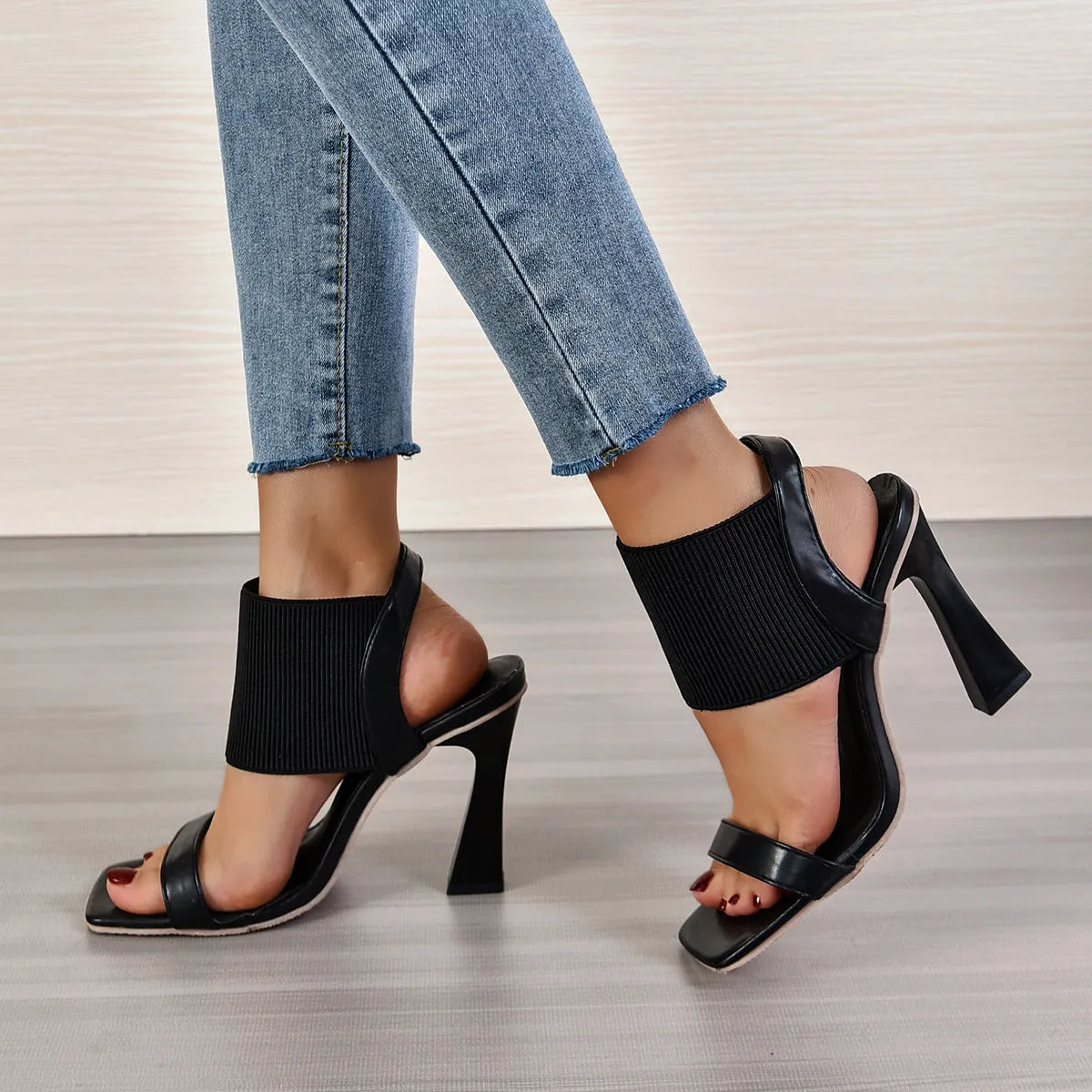 Women's black high heel sandals with elastic strap and rubber sole