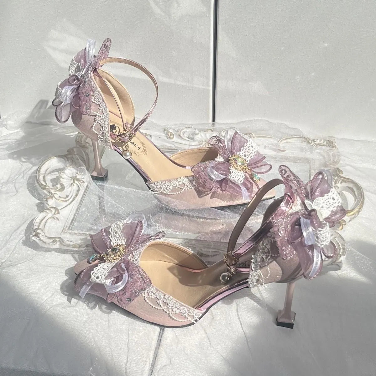 Purple satin Lolita shoes with a stiletto heel and square toe on a white background.
