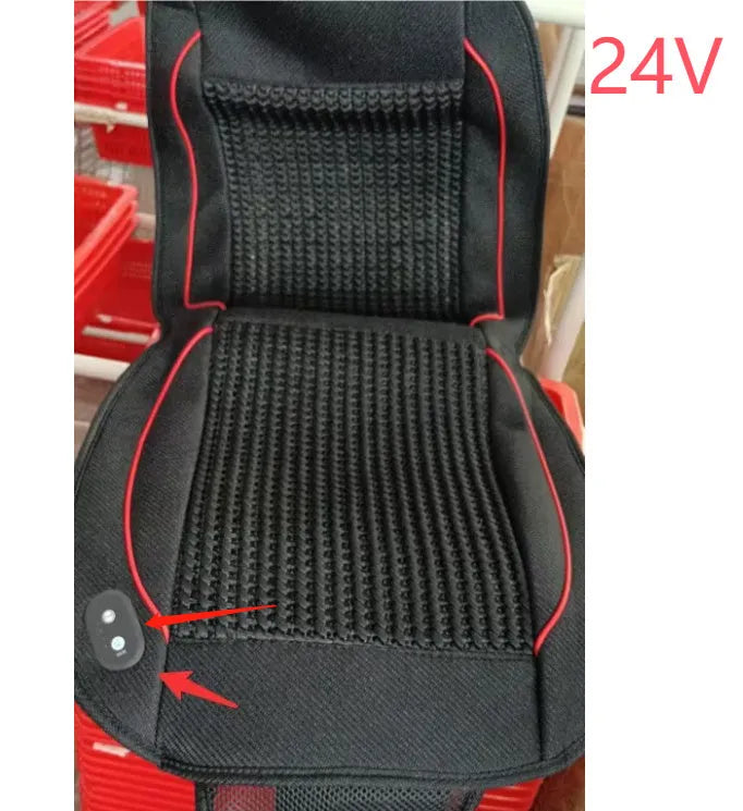 Black car ventilation seat cushion with power cord, shown on a car seat