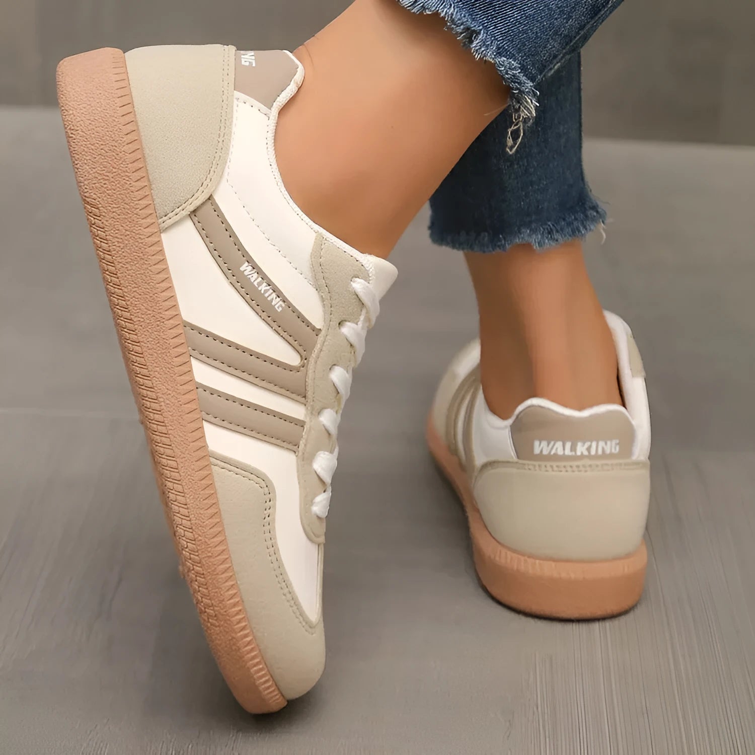 A pair of retro-style low-top lace-up sneakers in a selected colour on a plain background.