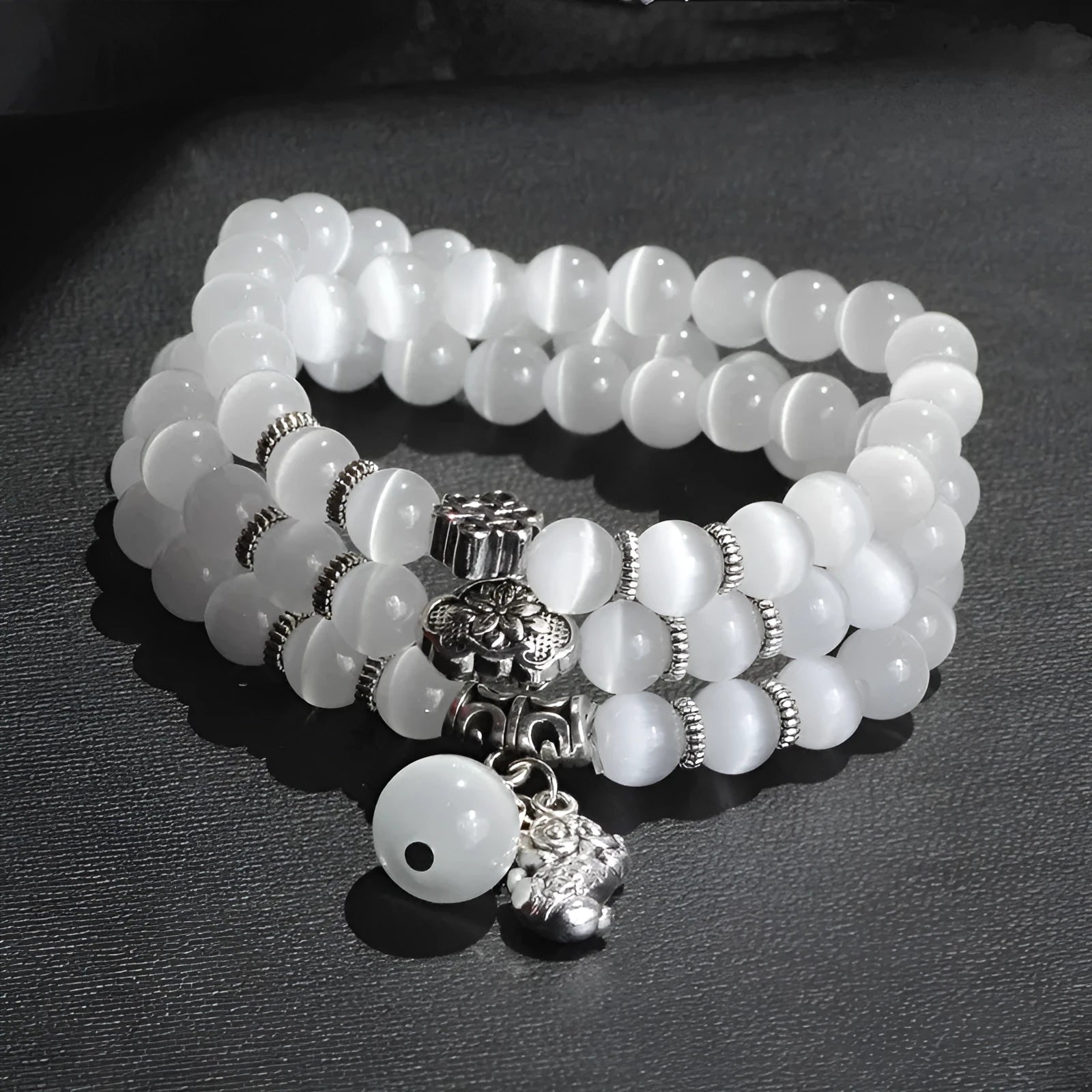 Opal crystal cat eye bracelet with lucky cat charm, shown in one of six colour options.