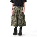 Men's straight-leg cropped trousers in a green and brown camouflage pattern, made from cotton denim.