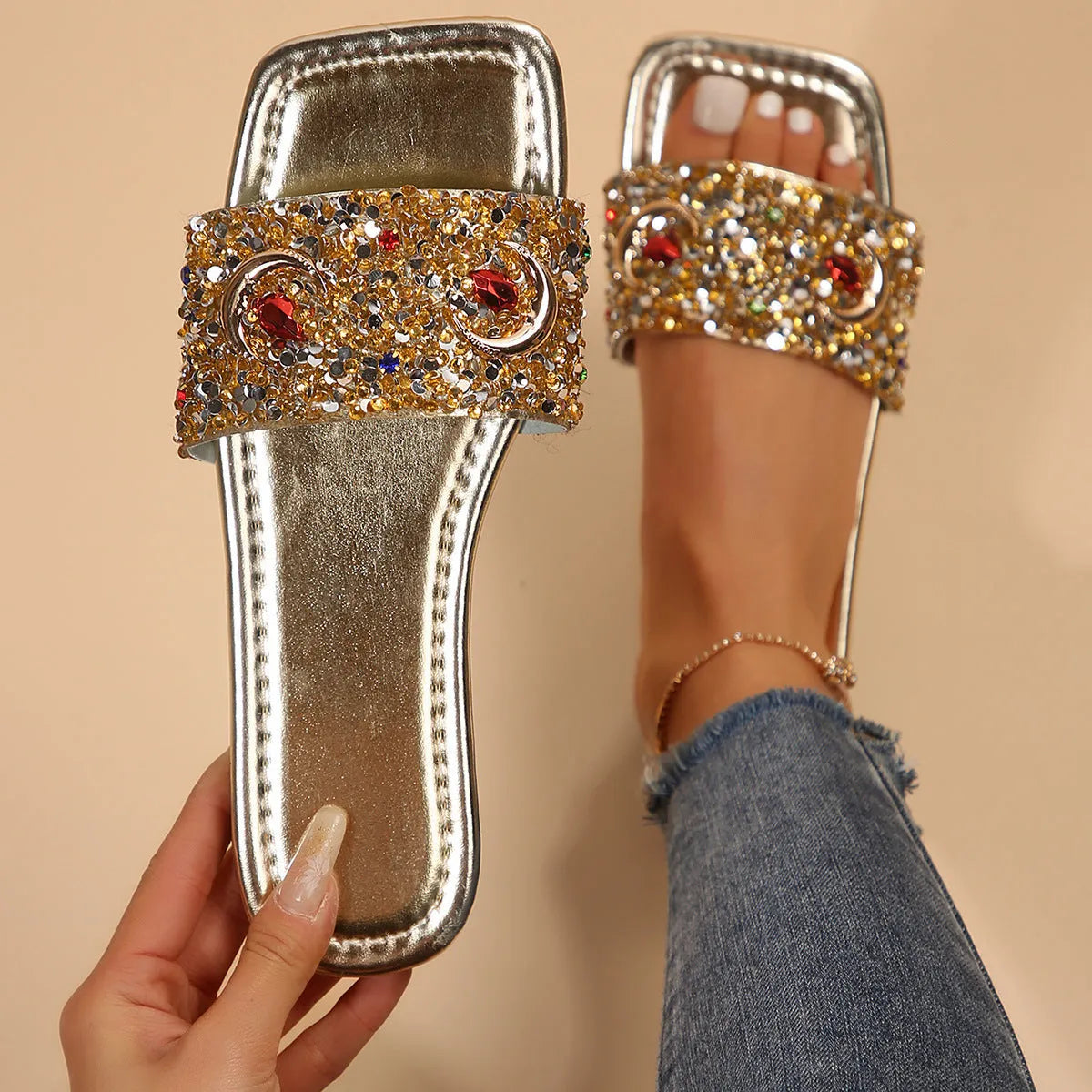 Gold women's flat slippers with rhinestone and sequin decoration on the upper.