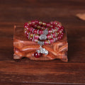 Watermelon crystal bracelet with Chinese knot closure and elephant bead design