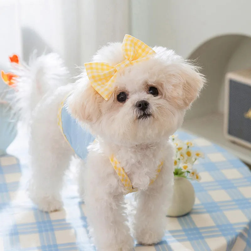 Small dog wearing heart bow suspenders vest in elastic polyester pet clothing