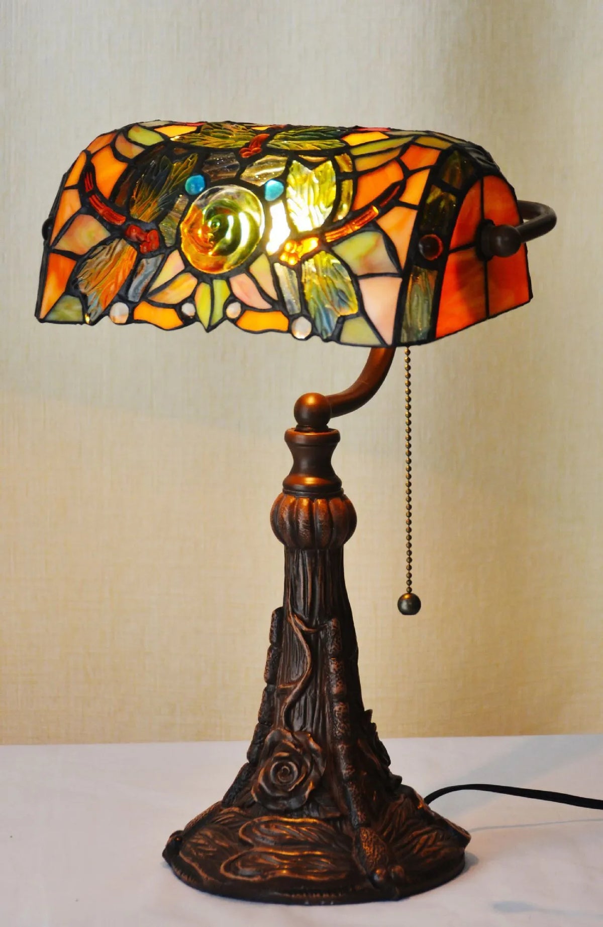 10-inch Tiffany table lamp with stained glass shade and resin base on a study desk