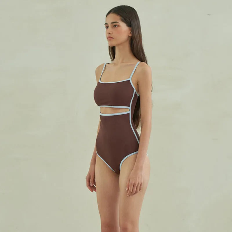 Brown triangle one-piece swimsuit for women on a mannequin.