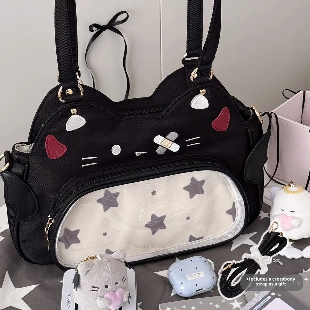 Horizontal cartoon owl pin PU crossbody bag in black, side view showing stitching and single strap