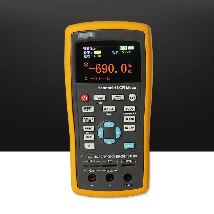 ET432 handheld LCR digital bridge with 2.8 inch TFT LCD screen and Kelvin test clamp on bench