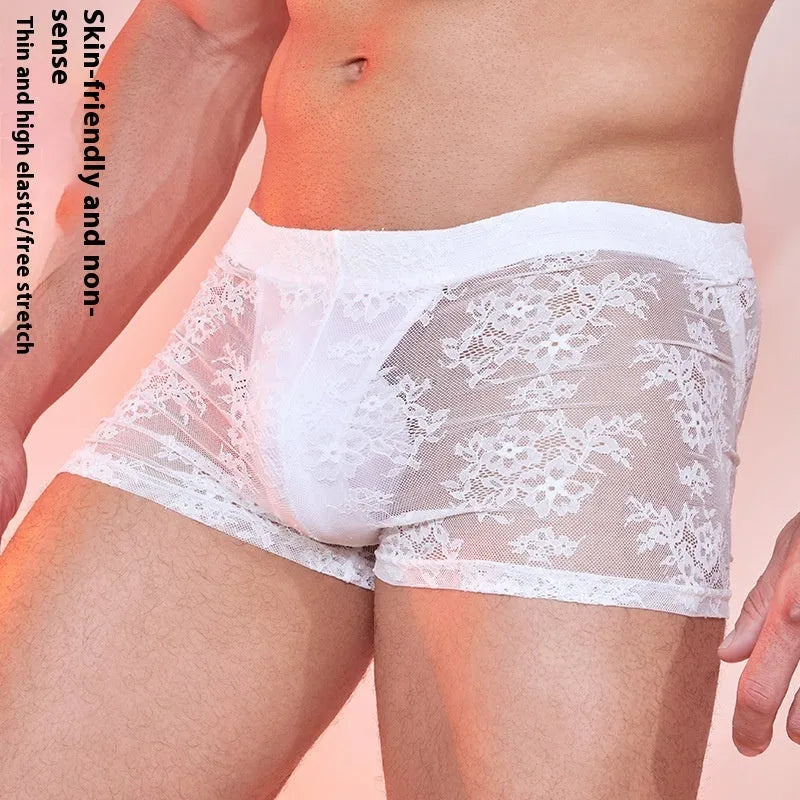 Black, white, and red nylon men's boxer briefs on a plain background.