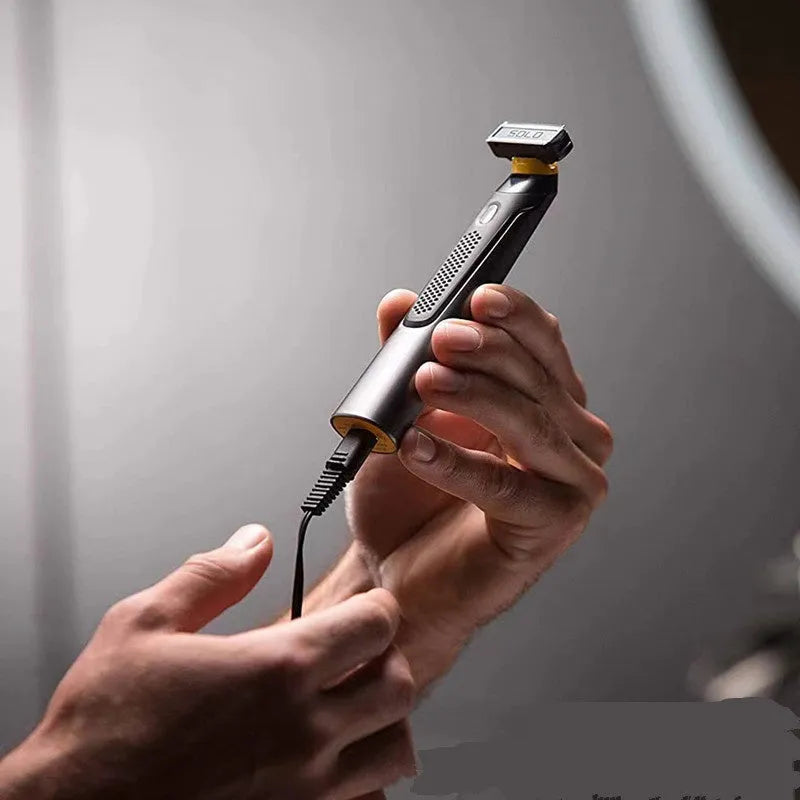 Black rechargeable men's precision shaver with LED light on and stainless steel blades.