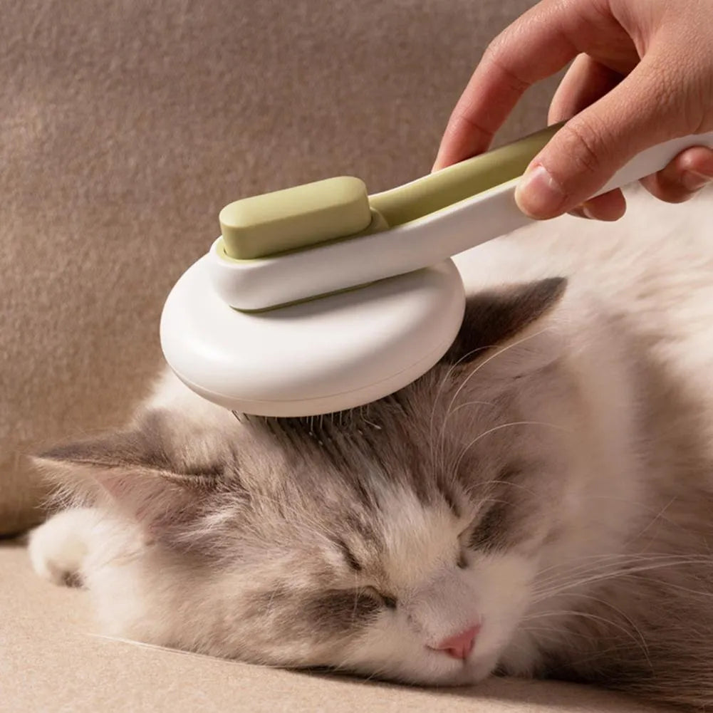 Blue automatic pet hair remover comb with stainless steel teeth and a button on the handle.