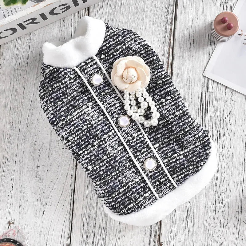 Black or purple sausage-themed cat jacket with Velcro fastening on a small feline