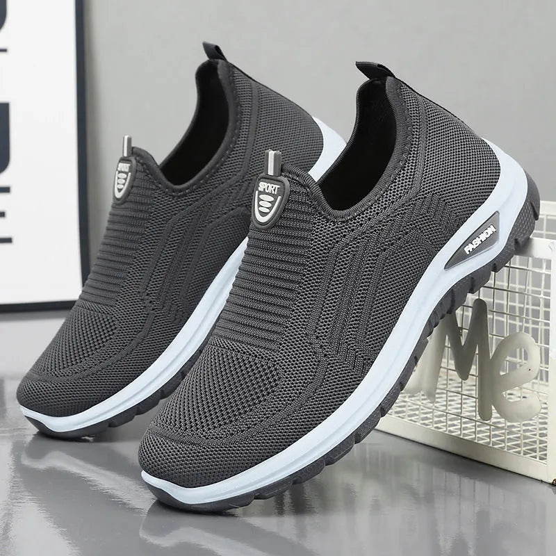 Men's black and grey breathable casual shoes with mesh uppers and PVC soles in a round-toe tennis style.