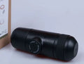 Black portable manual coffee machine measuring 6×17.5cm with stainless steel components