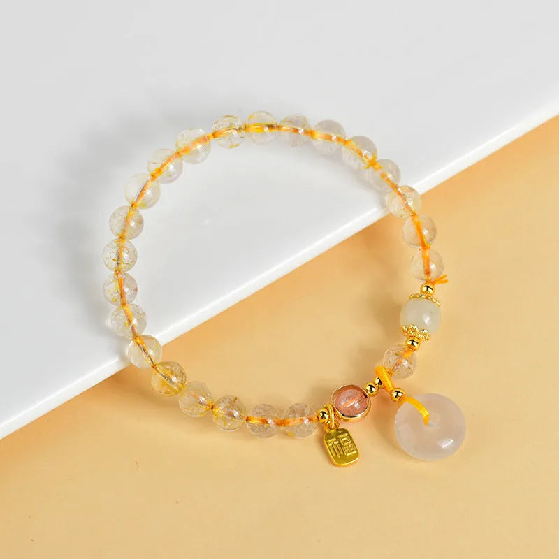 Gold rutilated quartz crystal bracelet with safety buckle and geometric pendant in national style design