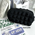 Cream puff style polyester fabric pencil case for pens, shown in beige and black colour options.