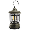 Dark green portable head lamp and camping lantern with dimensions 16.6x6.7x9.6 cm.