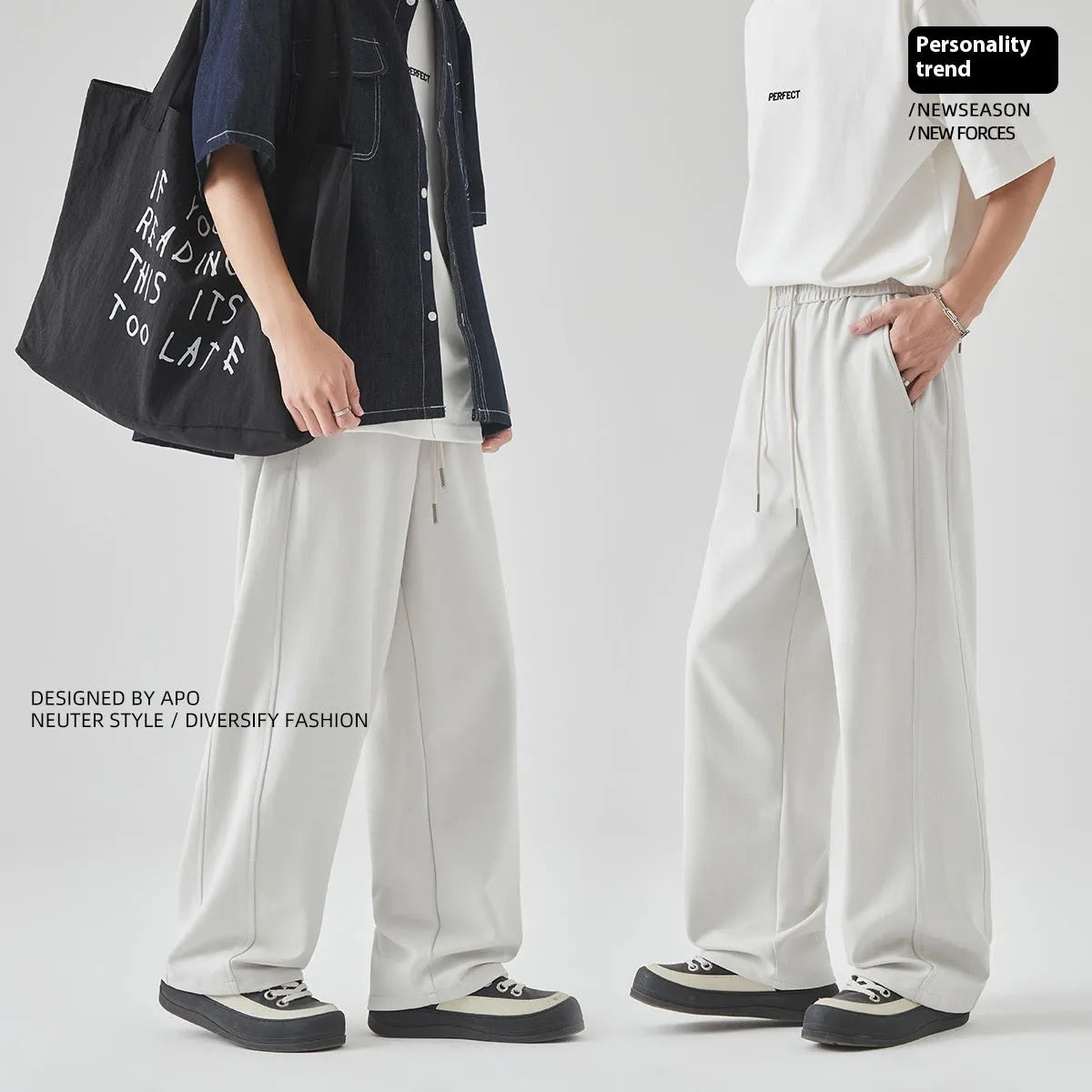 A pair of men's loose-fitting grey casual trousers with a high waist and straight leg on a plain background.