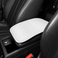 Carbon fibre pattern leather car armrest cushion mat in black, shown on a car centre console.