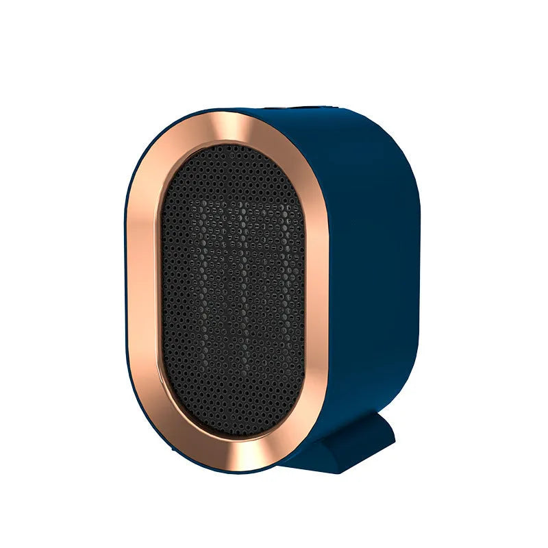 Desktop electric fan heater with black casing and UK plug, showing control knob and air vents
