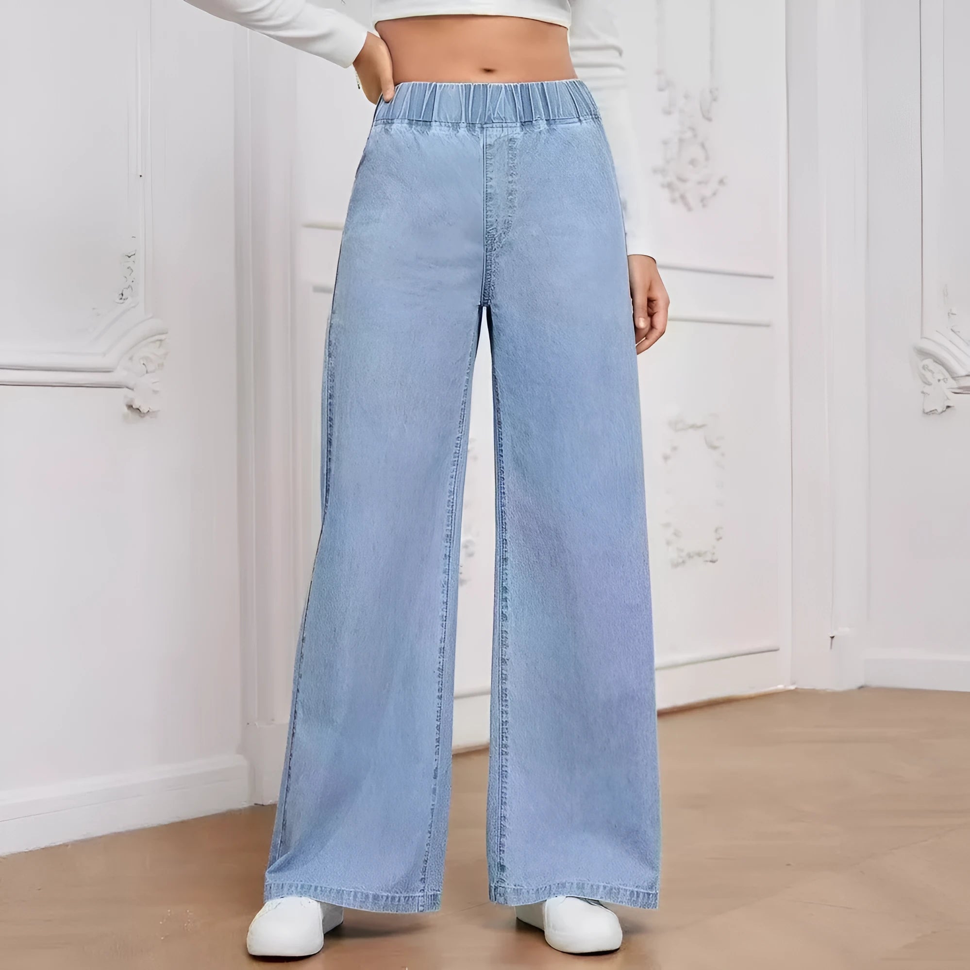 Light blue washed denim trousers with wide leg straight cut in plus sizes