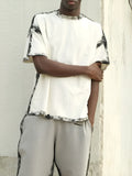 White casual short sleeve top with draped design and printed detail on polyester fabric