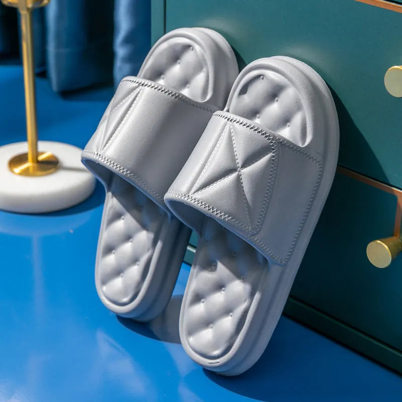 Pair of soft EVA non-slip bathroom slippers with a thick sole, shown in a choice of colours.