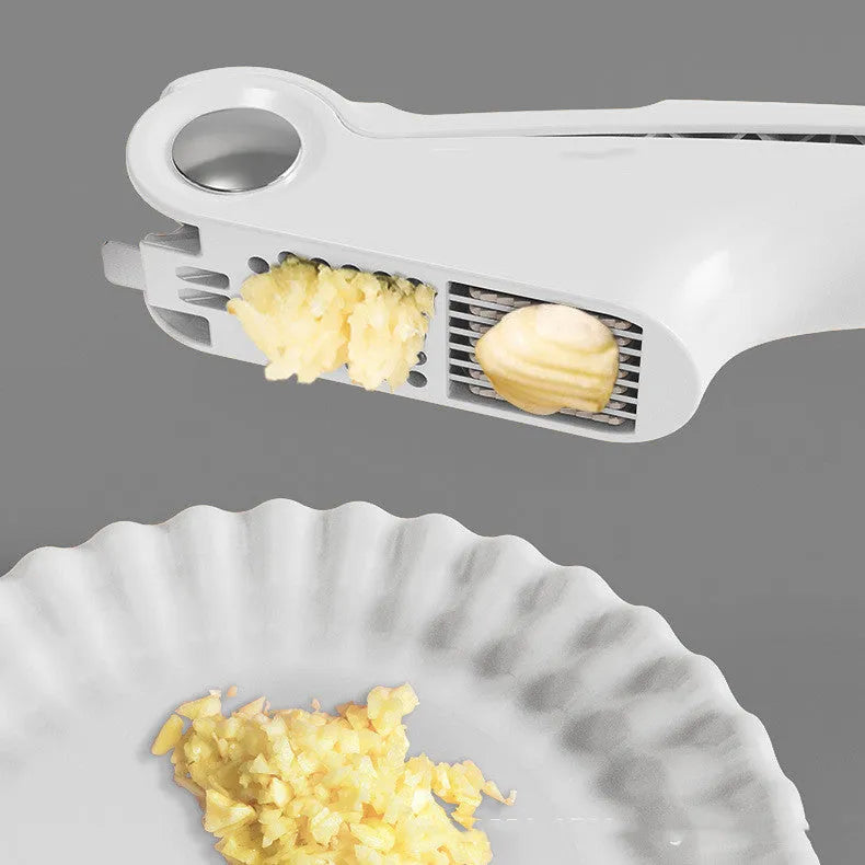 Manual garlic press with ABS handle and stainless steel press mechanism in green colour