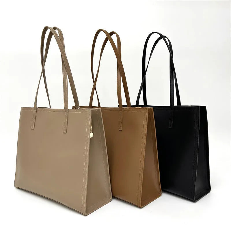 Brown genuine leather one shoulder handbag with horizontal square shape showing multiple internal compartments