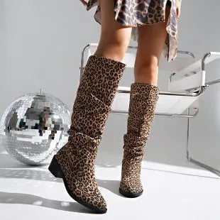 Brown leopard print women's winter boots with a chunky square toe and mid-height heel on a white background.
