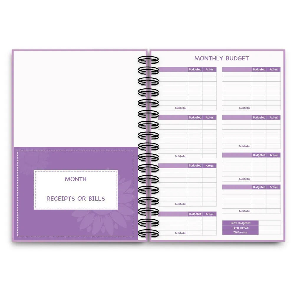 J12 purple coil-bound financial planning notebook with budget stickers and paper clips on Daolin paper pages