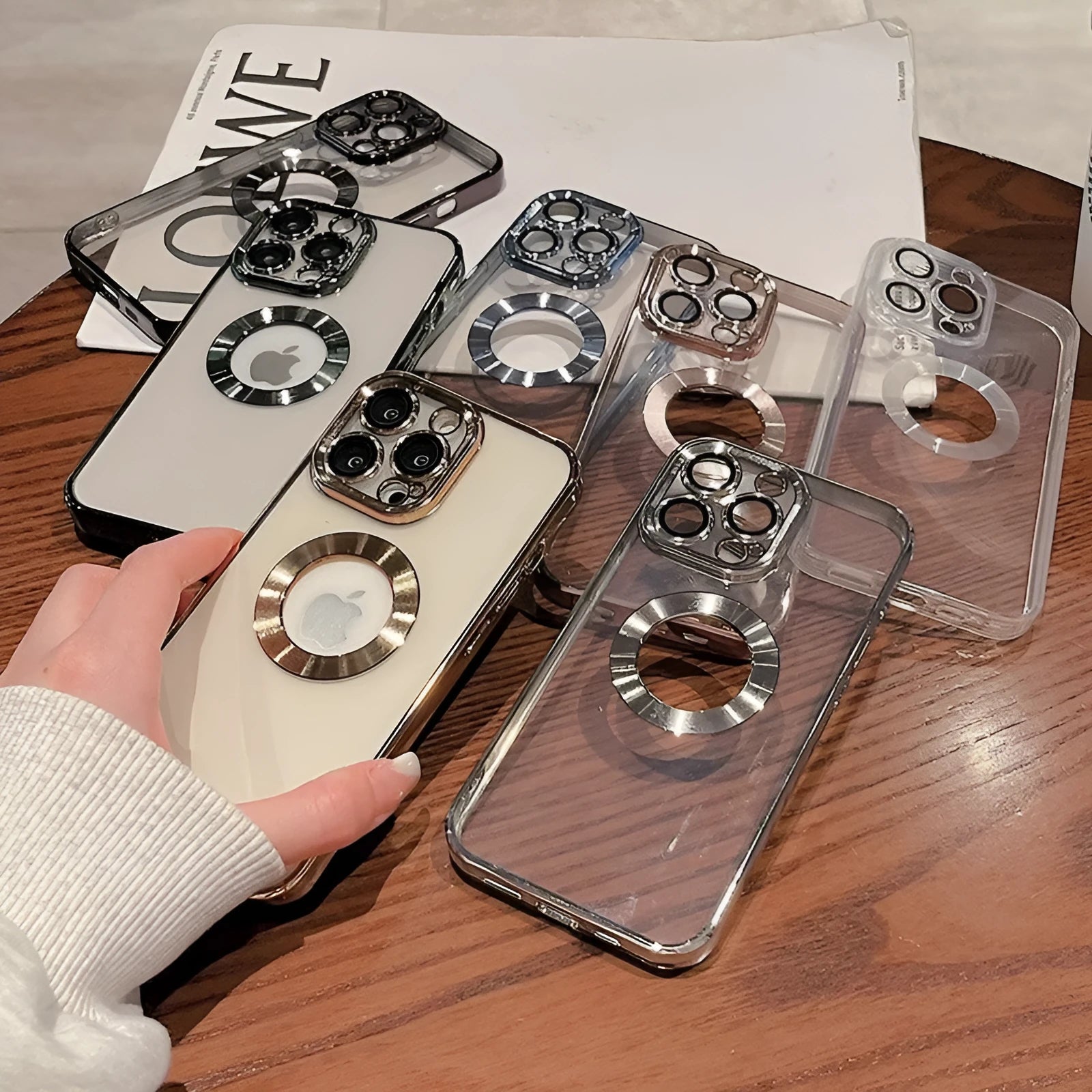 Transparent electroplated silicone iPhone case with built-in camera lens protector in multiple colour options.