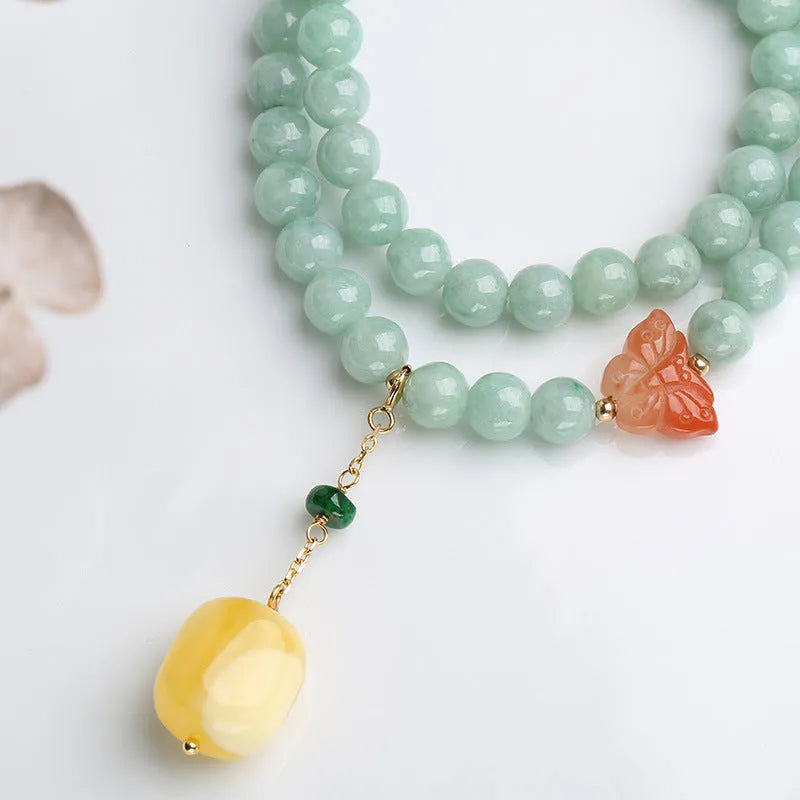 Close-up of a double-layer women's bracelet with jade round beads and beeswax barrel beads in a retro geometric design