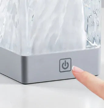 Compact crystal lamp 80x80x12mm with touch sensor and USB cable on a wooden desk