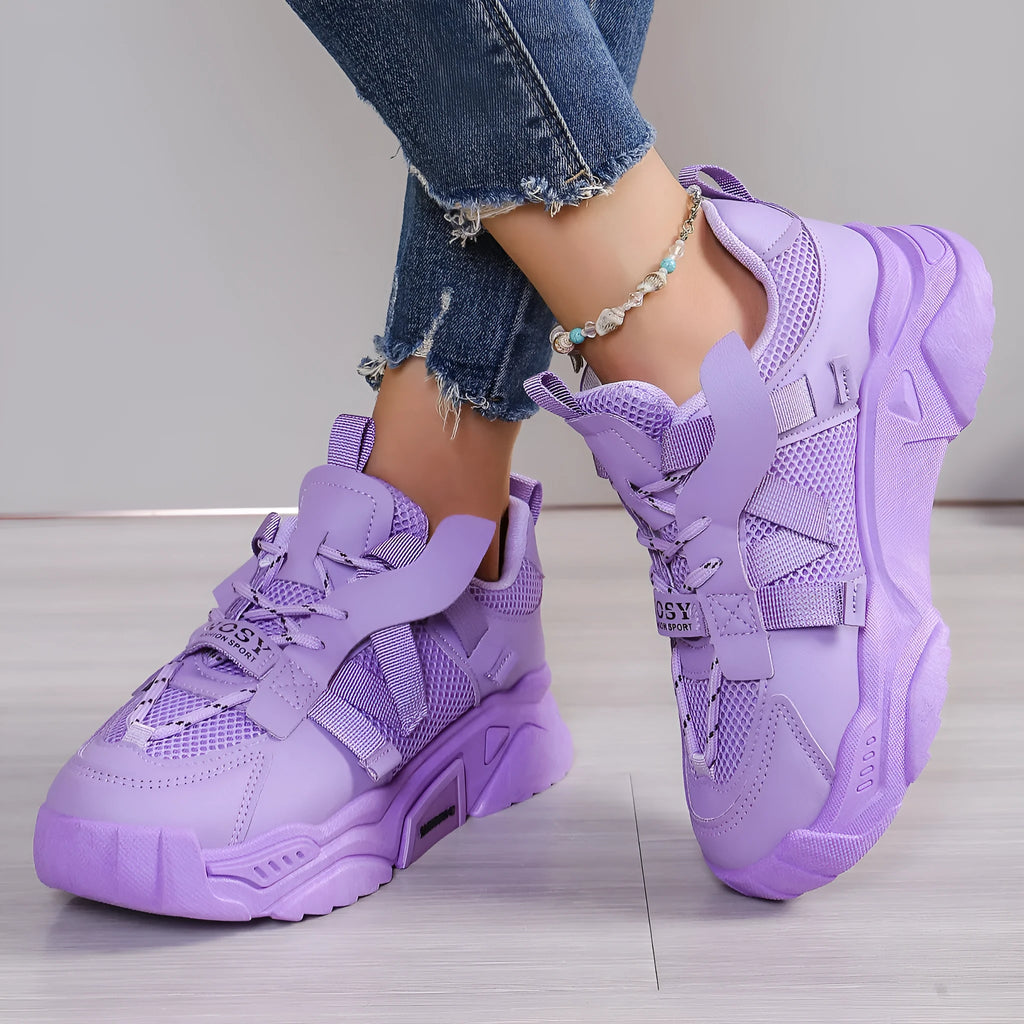 Women's purple platform mesh sports shoe with front lace-up, shown on a white background.