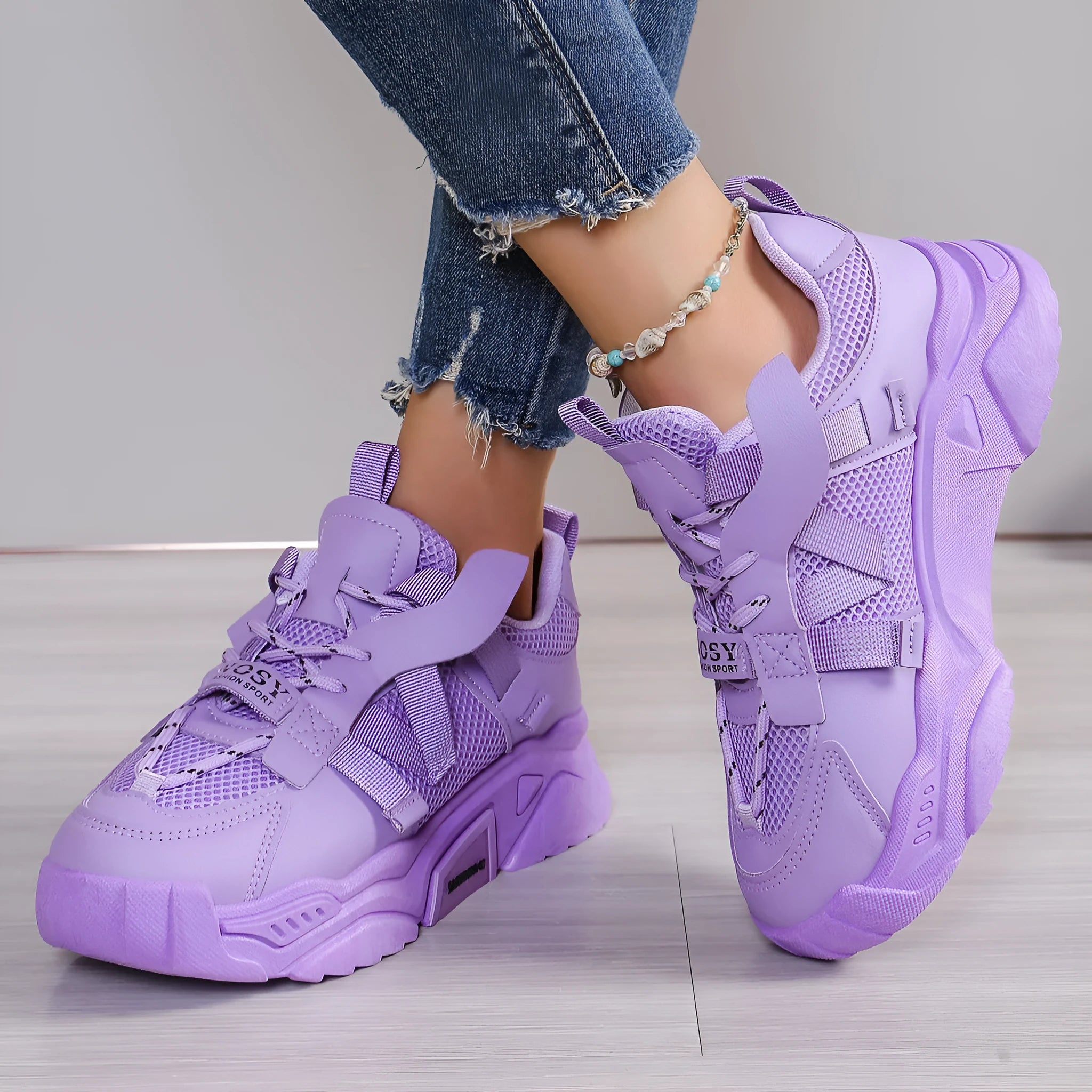 Women's purple platform mesh sports shoe with front lace-up, shown on a white background.