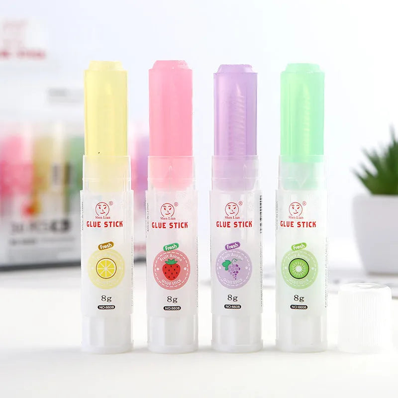 Two fruit-printed jelly solid glue sticks showing random colours and compact 8.5 cm size