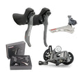 Aluminium road bike transmission kit showing hand change dial, front dial, short leg rear derailleur, chain, and decorative beads.