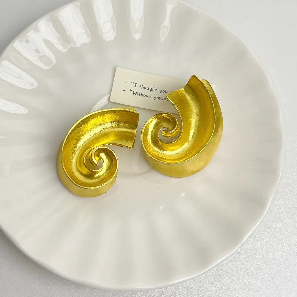 Geometric retro ear studs in alloy with electroplated gold or silver finish measuring 5cm