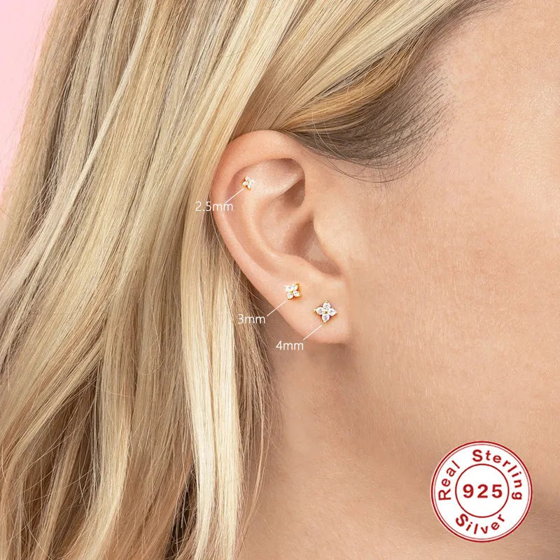 S925 sterling silver stud earrings with a geometric crystal flower design in gold or platinum plating.