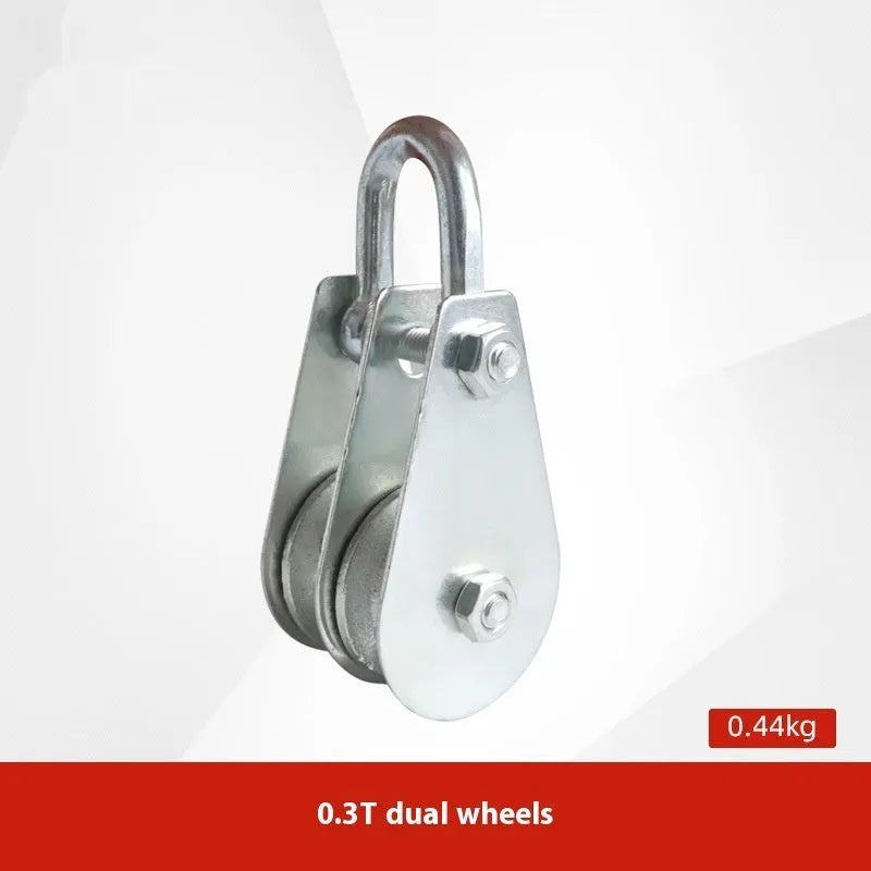 Red industrial lifting pulley with a forged steel safety latch hook and wire rope wheel.