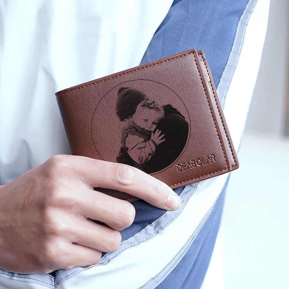 Men's brown leather wallet with a gold zipper closure laid flat.