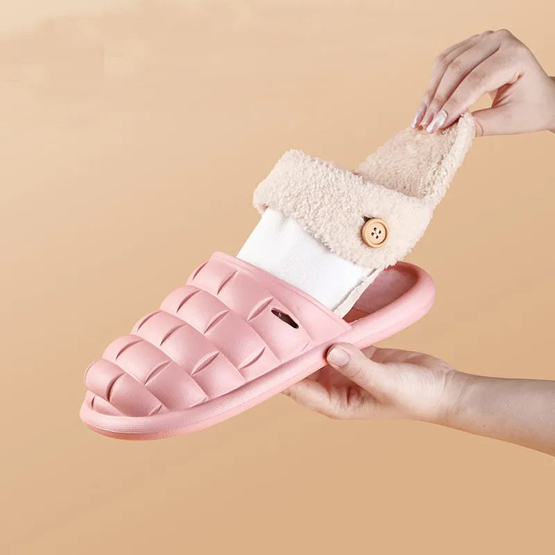 Plaid detachable slippers for women with plush lining and EVA sole in pink, shown on a wooden floor.